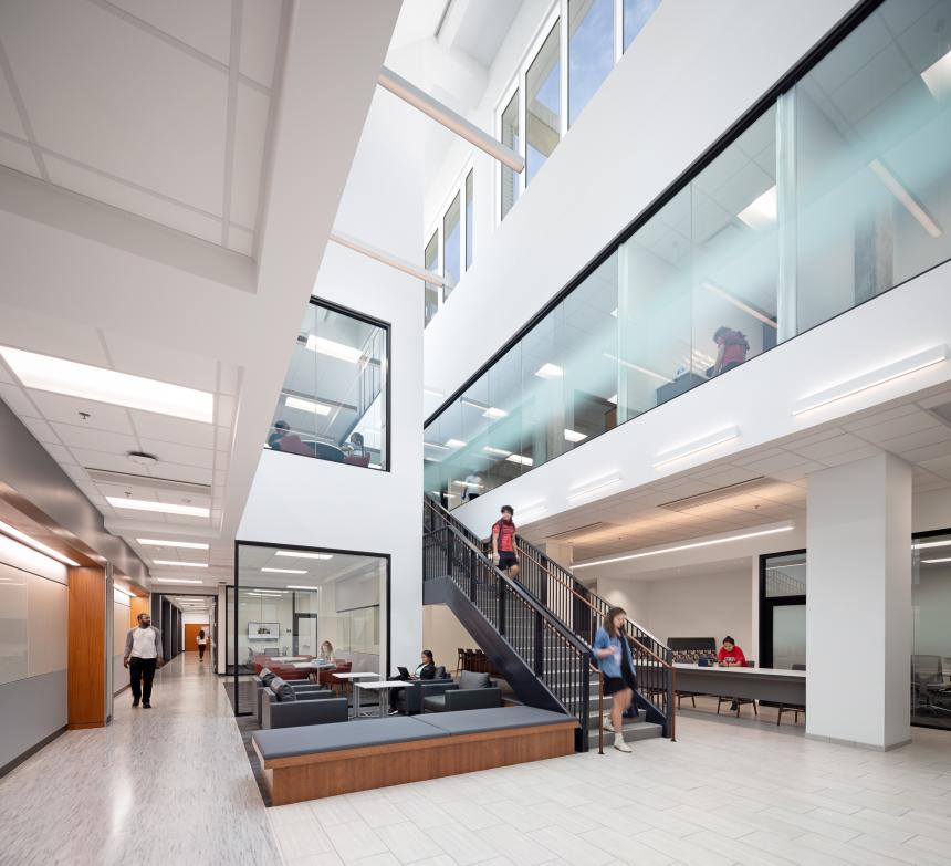The atrium area of STEM1 featuring three floor high skylights and a sun-lit seating area